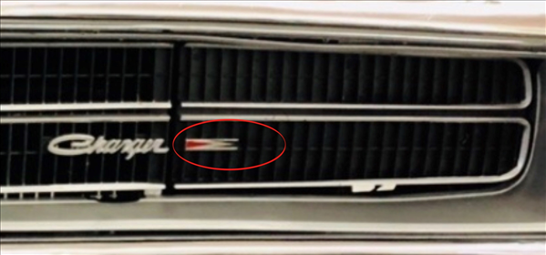 VC8279 - 1970 Charger Arrow Headlight Door Grille emblem.