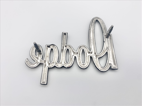 VC9928 - 1970 Dart DODGE Script Trunk Emblem. 2 pin